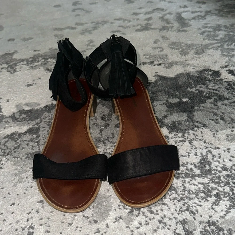 Rock & Candy Black suede tassle ankle strap low heeled sandals